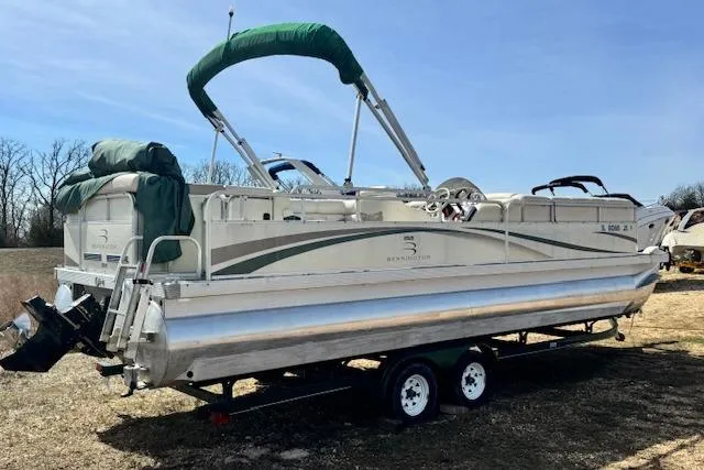 Slide: The Image of 2002 Bennington 2575RL I/O pontoon boat on trailer, green canopy, parked outdoors. - 5