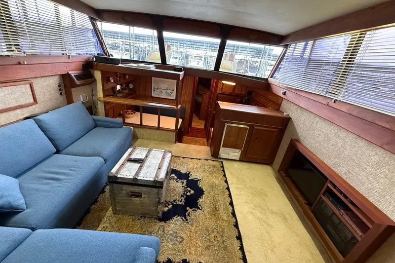 Slide: The Image of Interior of 1979 Viking 43 Double Cabin with blue sofa and vintage decor. - 10