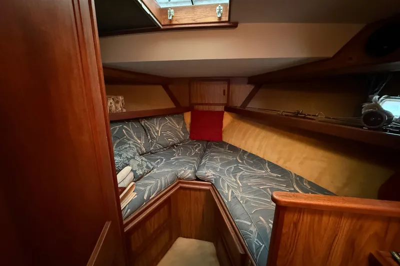 Slide: The Image of Cozy cabin interior of 1979 Viking 43 Double Cabin with patterned cushions and wooden accents. - 15