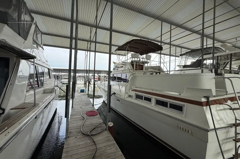 Slide: The Image of 1979 Viking 43 Double Cabin yacht docked in a covered marina. - 2