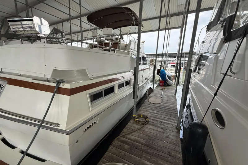 Slide: The Image of 1979 Viking 43 Double Cabin yacht docked in a covered marina. - 3
