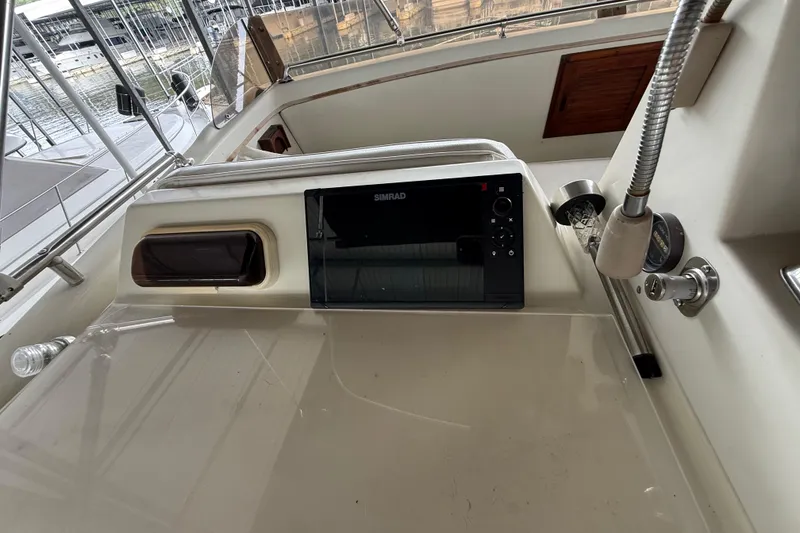 Slide: The Image of Helm of 1979 Viking 43 Double Cabin with navigation equipment and controls. - 6