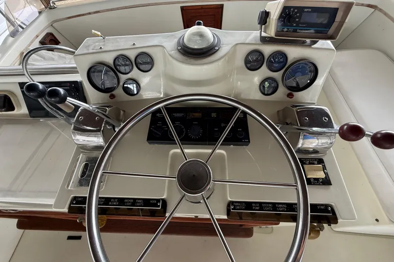 Slide: The Image of 1979 Viking 43 Double Cabin helm with gauges, steering wheel, and controls. - 7