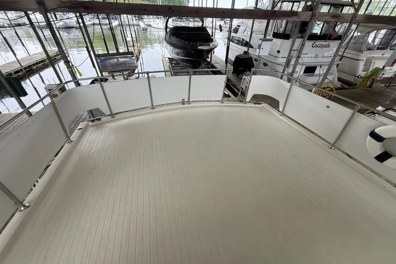 Slide: The Image of Spacious deck of 1979 Viking 43 Double Cabin yacht in marina setting. - 9