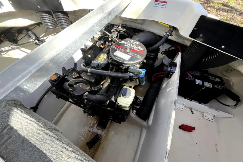 Slide: The Image of Engine compartment of a 2008 Sea Ray 185 Sport boat, featuring a 3.0L Mercury engine. - 16