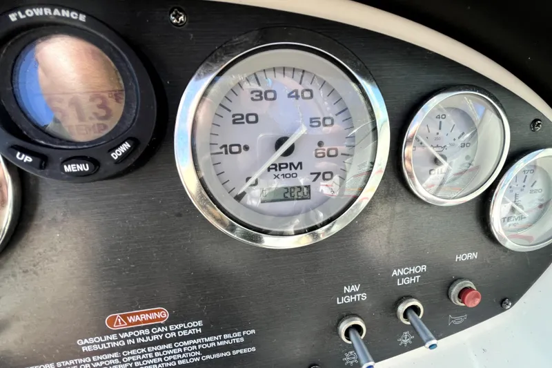 Slide: The Image of Dashboard of a 2008 Sea Ray 185 Sport boat showing gauges and controls. - 17