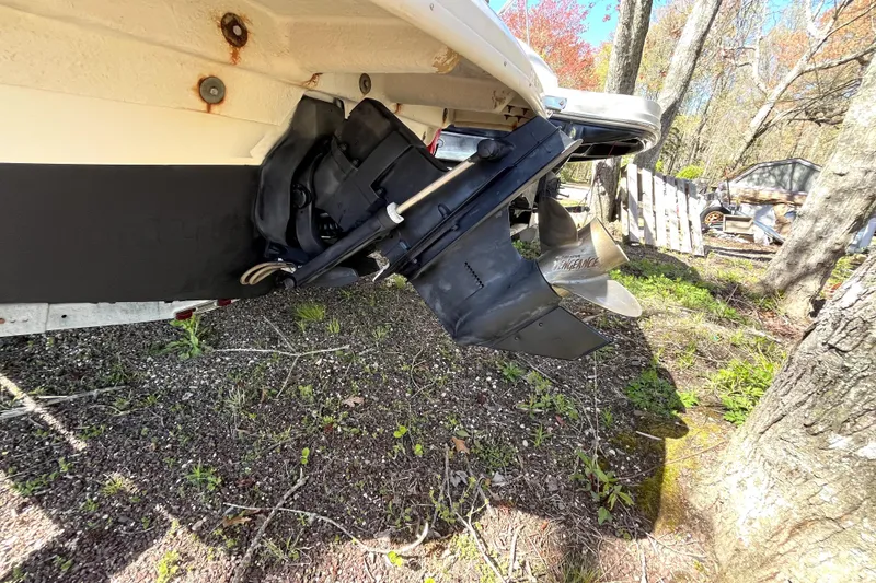 Slide: The Image of 2008 Sea Ray 185 Sport boat propeller and stern drive in wooded area. - 18