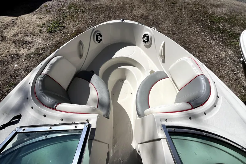 Slide: The Image of 2008 Sea Ray 185 Sport boat interior with gray and white seating. - 4