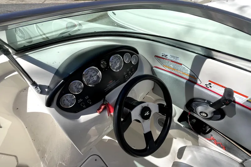 Slide: The Image of 2008 Sea Ray 185 Sport boat dashboard with steering wheel and instrument panel. - 8