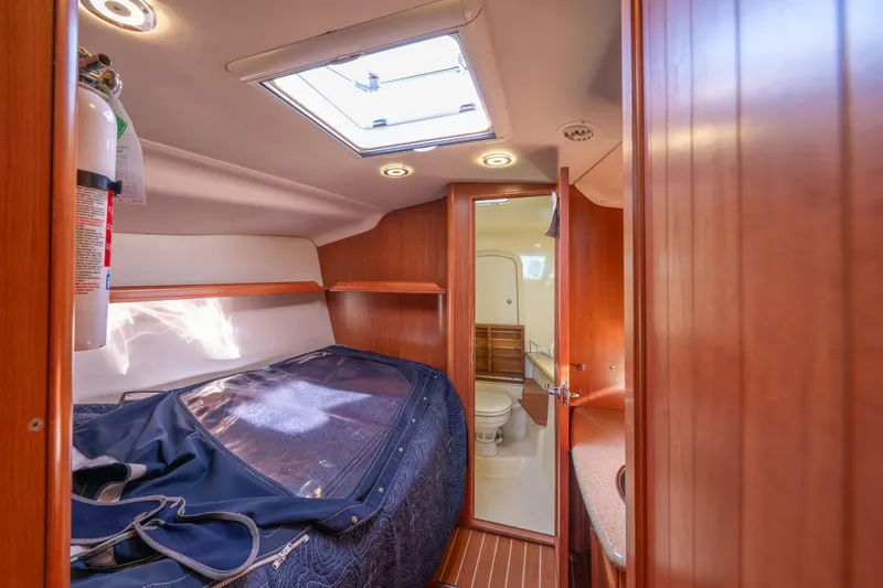 Slide: The Image of Interior of 2008 Hunter 45 Deck Salon yacht with cozy cabin and bathroom. - 10