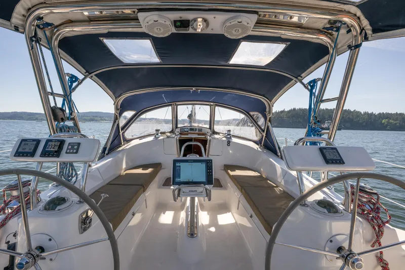 Slide: The Image of Interior view of 2008 Hunter 45 Deck Salon sailboat cockpit with navigation equipment. - 18