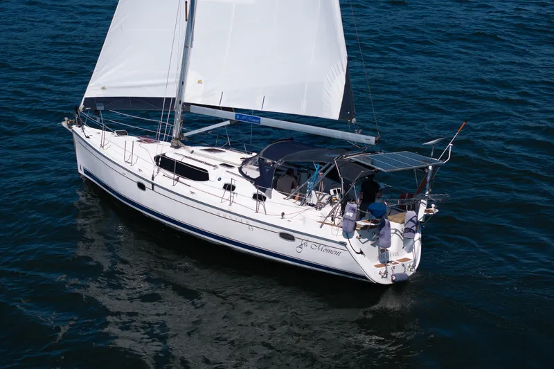 Slide: The Image of 2008 Hunter 45 Deck Salon sailboat cruising on open water. - 4
