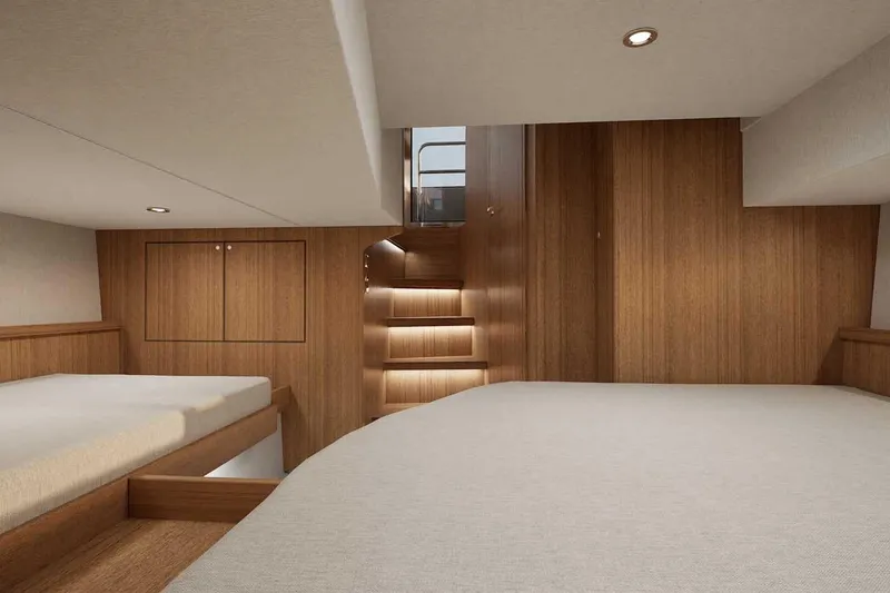 Slide: The Image of Luxurious interior of 2027 Targa TARGA 37 yacht with wooden finishes and cozy bedding. - 12