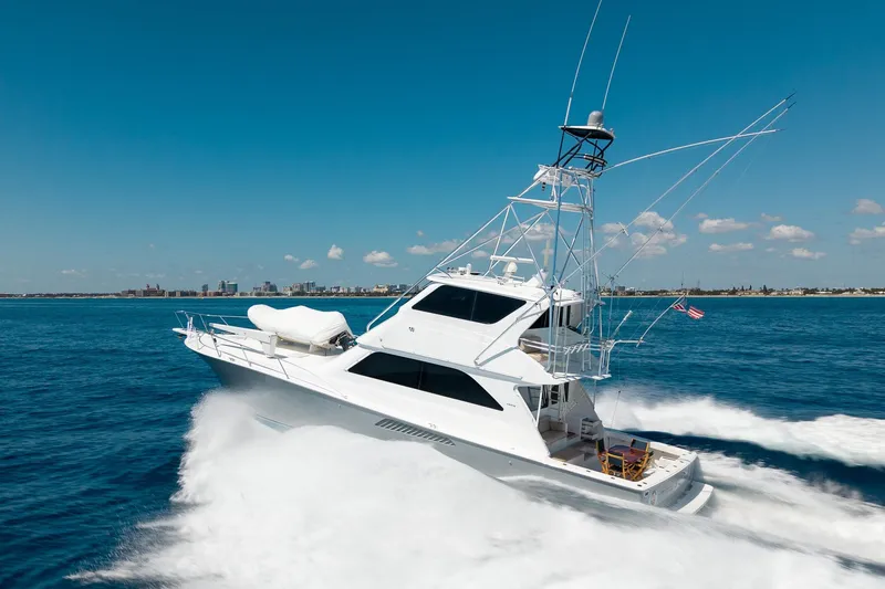 Slide: The Image of 2005 Viking 61 Enclosed Bridge yacht cruising on open water. - 16