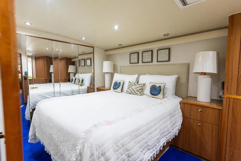Slide: The Image of Luxurious bedroom interior on 2005 Viking 61 Enclosed Bridge yacht with elegant decor. - 21