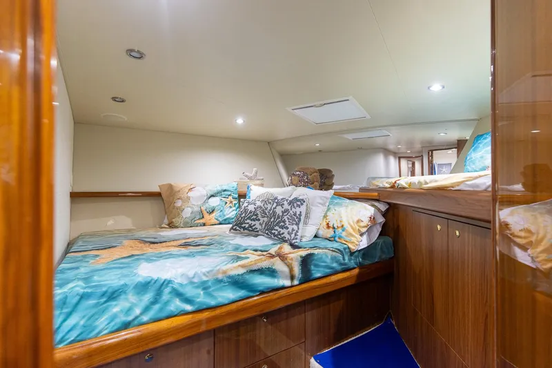 Slide: The Image of Luxurious cabin interior of 2005 Viking 61 Enclosed Bridge yacht with cozy bedding. - 22
