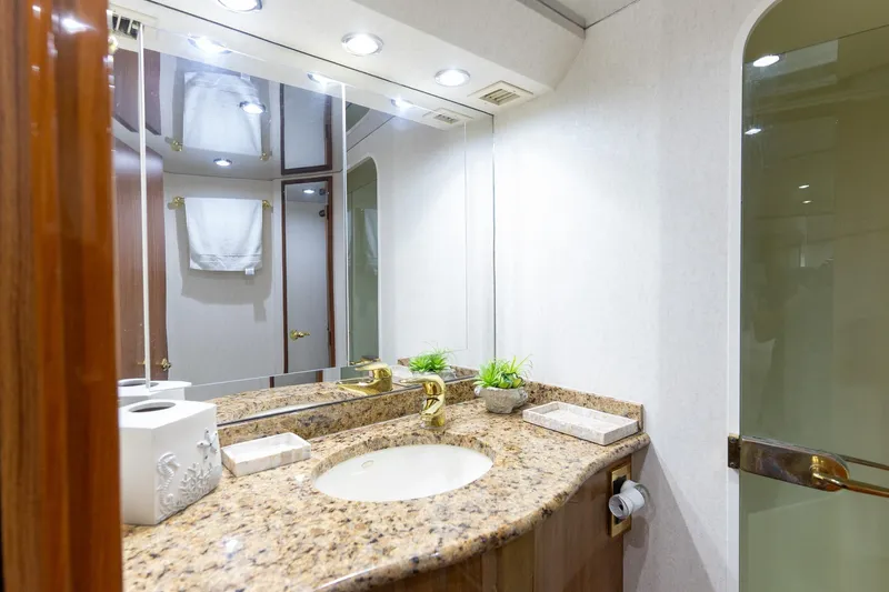 Slide: The Image of Luxurious bathroom on 2005 Viking 61 Enclosed Bridge yacht with granite countertop. - 25