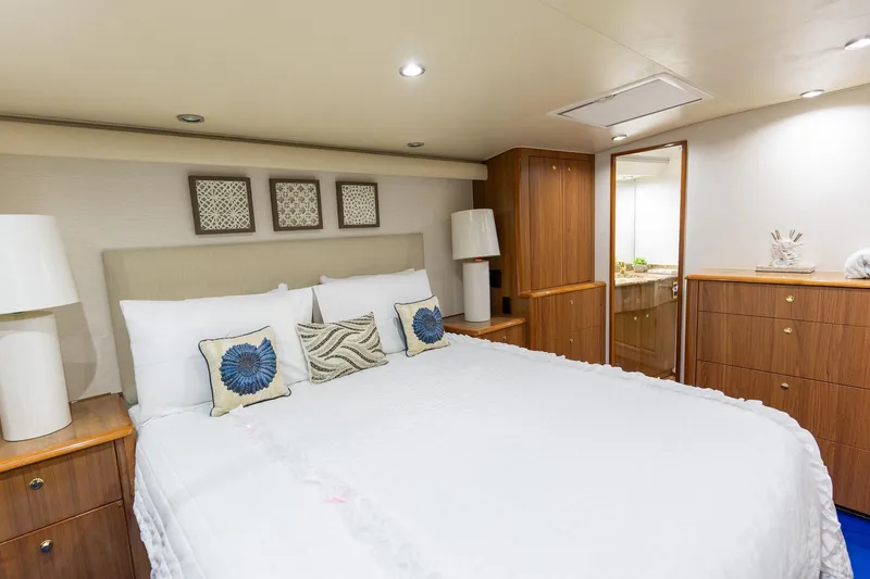 Slide: The Image of Luxurious bedroom interior of 2005 Viking 61 Enclosed Bridge yacht with elegant decor. - 28