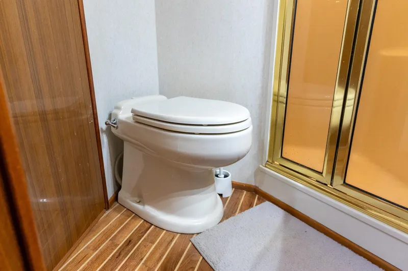 Slide: The Image of Bathroom interior of 2005 Viking 61 Enclosed Bridge yacht with toilet and shower. - 32