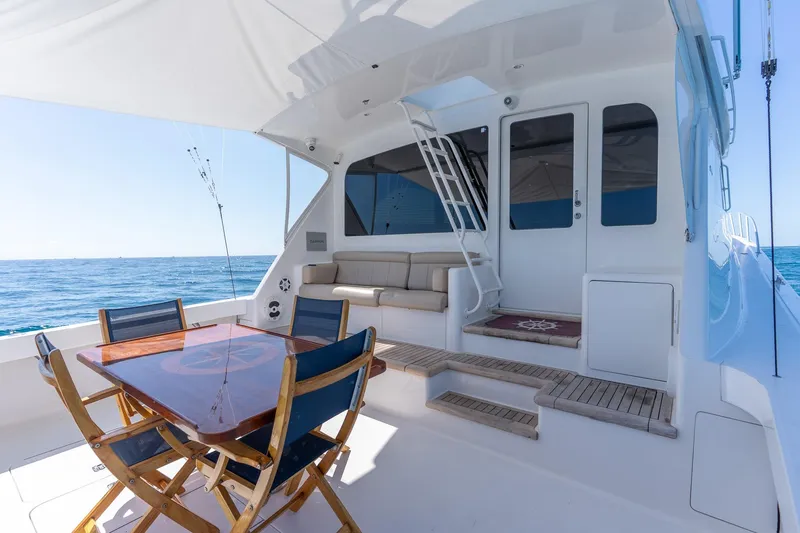 Slide: The Image of 2005 Viking 61 Enclosed Bridge yacht with outdoor seating and ocean view. - 34