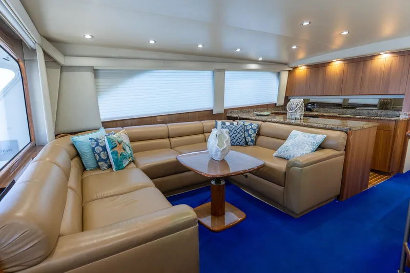 Slide: The Image of Luxurious interior of 2005 Viking 61 Enclosed Bridge yacht with leather seating and elegant decor. - 36