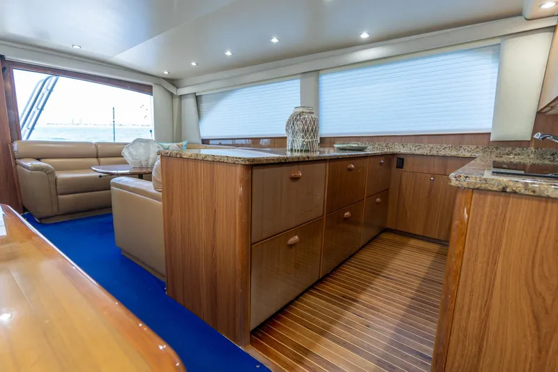 Slide: The Image of Luxurious interior of 2005 Viking 61 Enclosed Bridge yacht with elegant wood finishes. - 37
