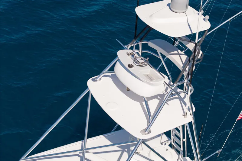 Slide: The Image of Aerial view of 2005 Viking 61 Enclosed Bridge yacht tower against deep blue ocean. - 4