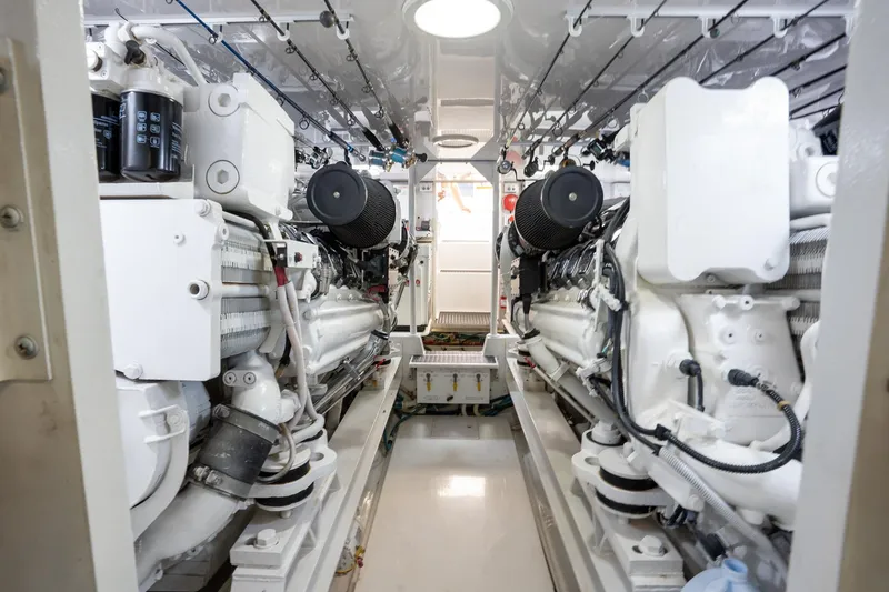 Slide: The Image of Engine room of 2005 Viking 61 Enclosed Bridge yacht, showcasing dual engines. - 50