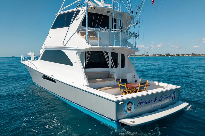 Slide: The Image of 2005 Viking 61 Enclosed Bridge yacht on open water, featuring spacious deck and seating. - 6