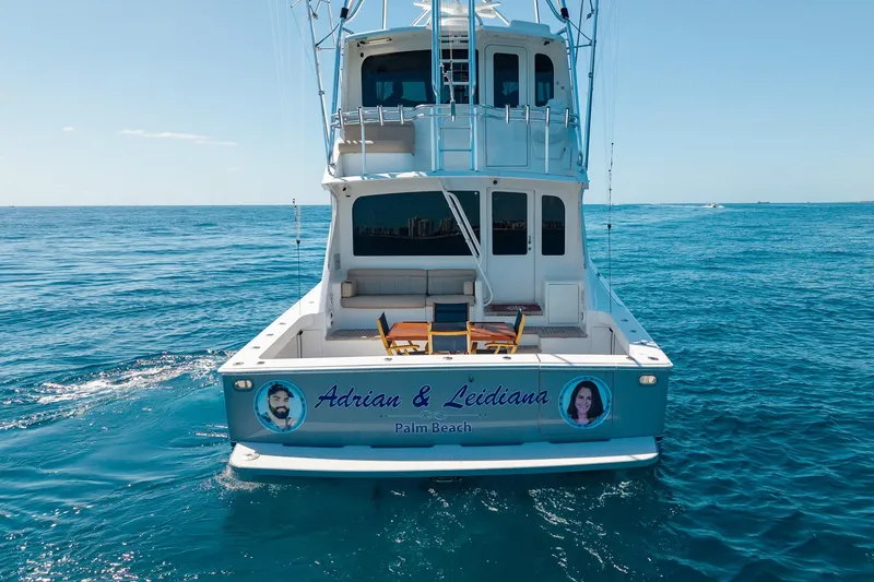 Slide: The Image of 2005 Viking 61 Enclosed Bridge yacht on open sea, featuring personalized name and images. - 7