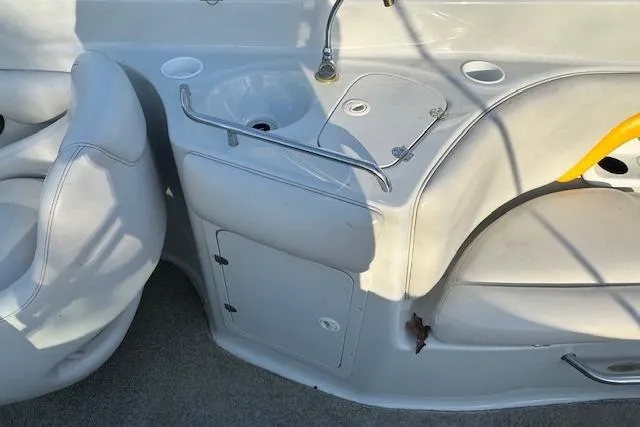 Slide: The Image of 2003 Crownline 270 BR boat interior with sink and seating area. - 15