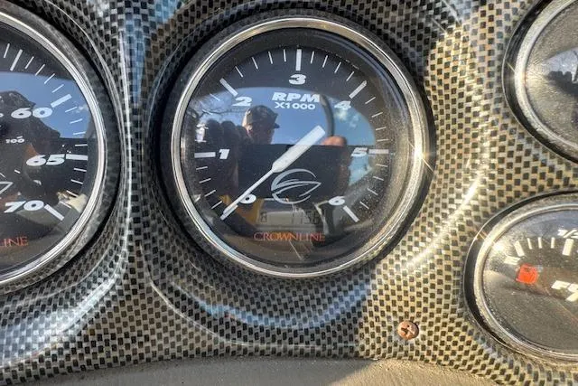 Slide: The Image of Dashboard of 2003 Crownline 270 BR boat showing RPM gauge. - 18