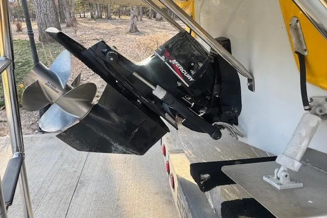 Slide: The Image of 2003 Crownline 270 BR boat with Mercury outboard motor and stainless steel propeller. - 23