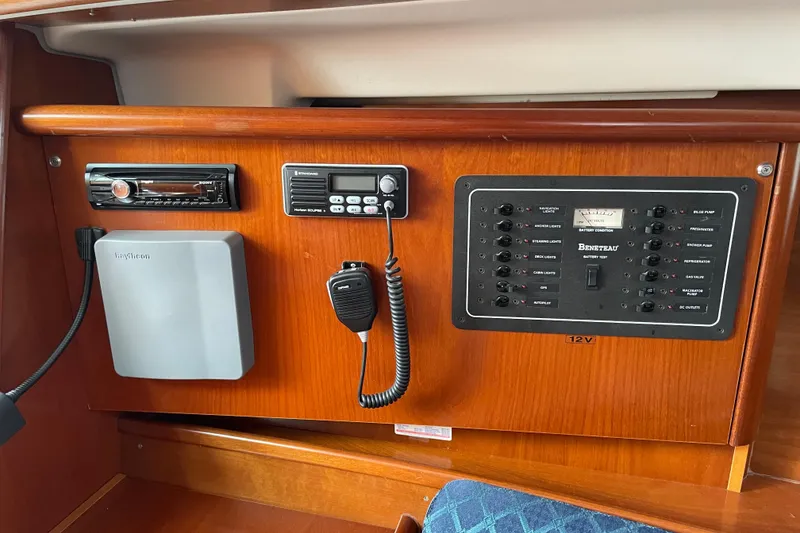 Slide: The Image of Control panel of a 2002 Beneteau 331 sailboat with navigation and communication equipment. - 24
