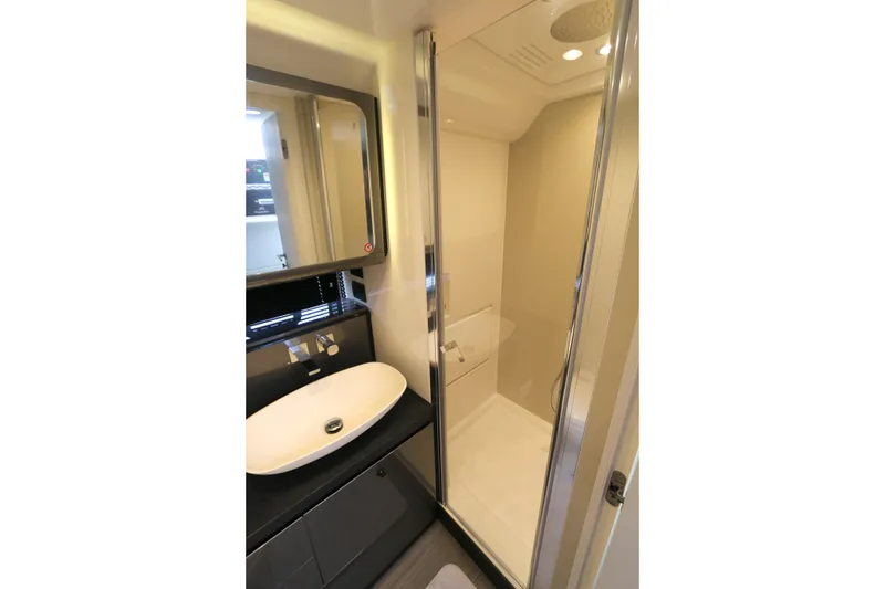 Slide: The Image of Modern bathroom interior on 2023 Azimut Verve 47 yacht, featuring sleek shower and sink design. - 10