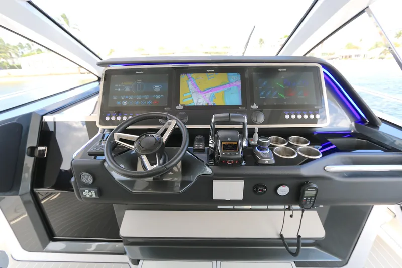 Slide: The Image of Helm of 2023 Azimut Verve 47 yacht with advanced navigation displays and controls. - 4