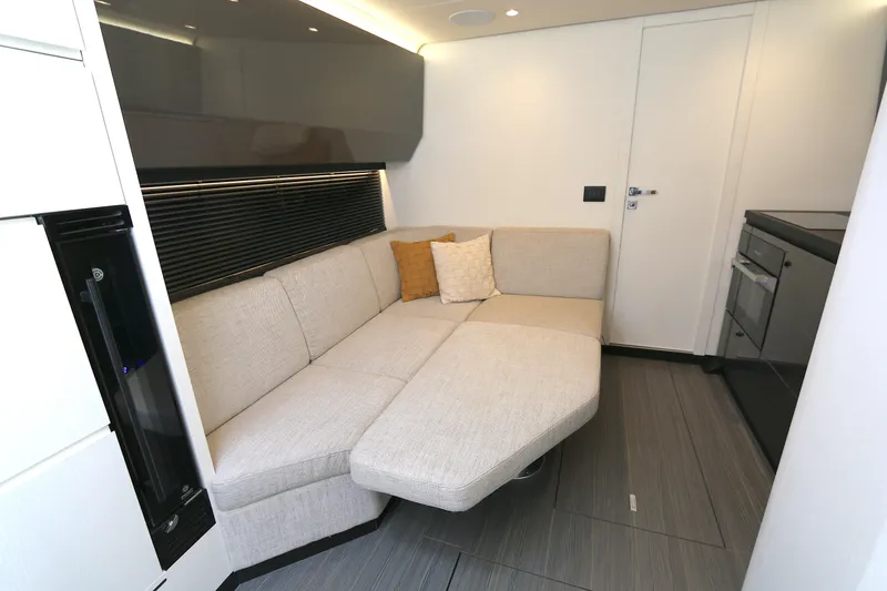Slide: The Image of Interior of 2023 Azimut Verve 47 yacht with modern beige sofa and sleek design. - 5