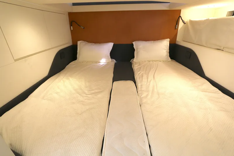 Slide: The Image of Interior cabin of 2023 Azimut Verve 47 yacht with twin beds and modern design. - 8