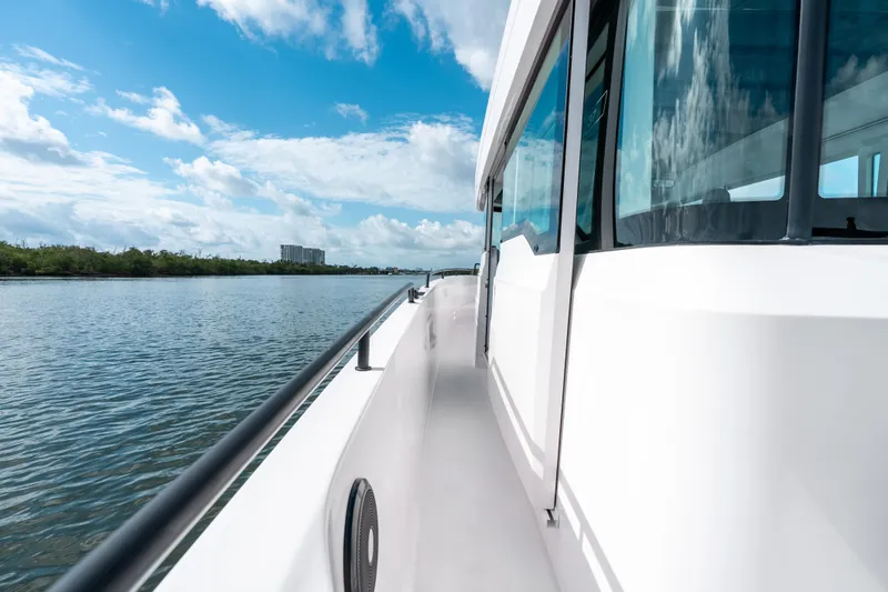 Slide: The Image of 2022 Axopar 37 XC Cross Cabin cruising on a sunny day. - 24