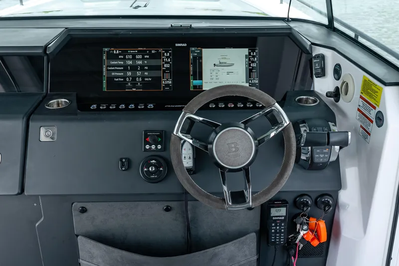 Slide: The Image of Cockpit of 2022 Axopar 37 XC Cross Cabin with advanced navigation displays. - 34