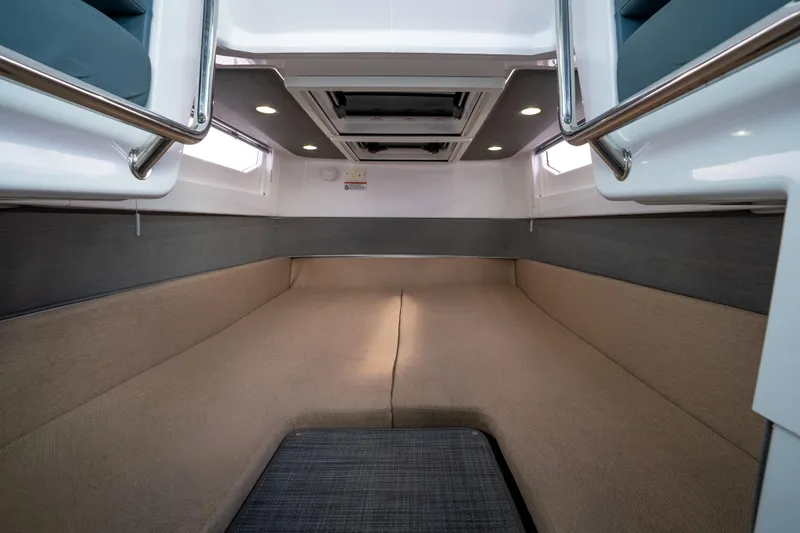 Slide: The Image of 2022 Axopar 37 XC Cross Cabin interior with modern seating and sleek design. - 37