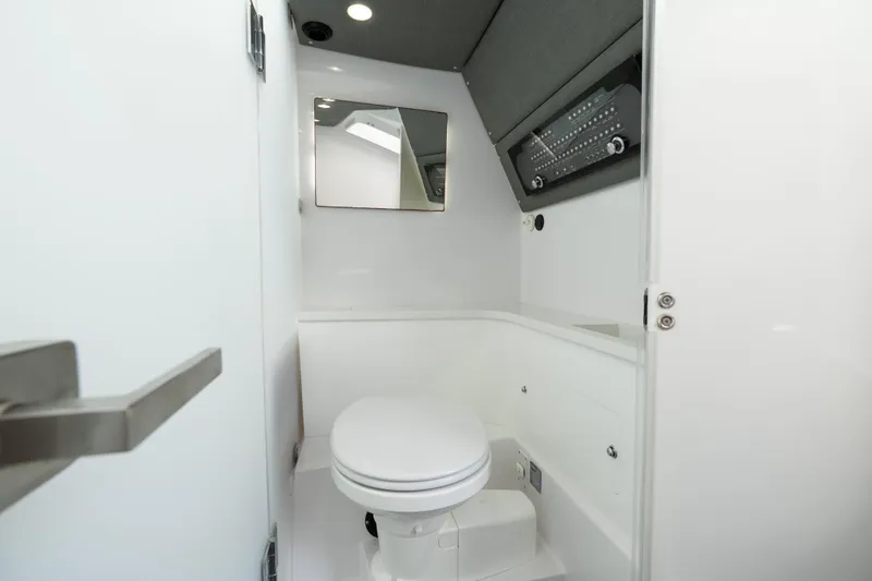 Slide: The Image of 2022 Axopar 37 XC Cross Cabin bathroom interior with modern fixtures and sleek design. - 39