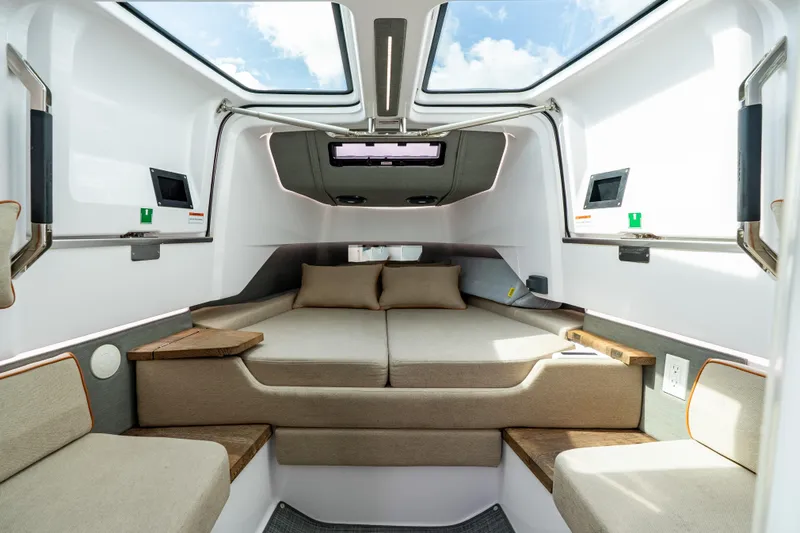 Slide: The Image of Luxurious interior of 2022 Axopar 37 XC Cross Cabin with skylights and comfortable seating. - 41