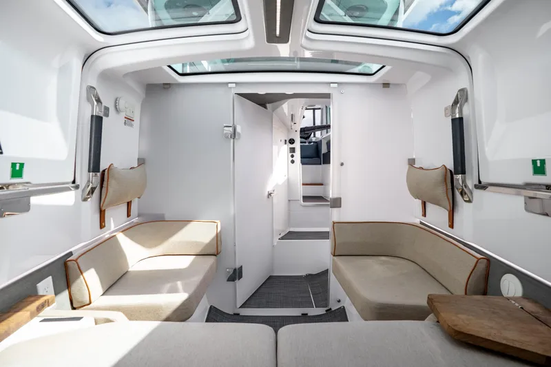 Slide: The Image of Interior of 2022 Axopar 37 XC Cross Cabin with seating and skylights. - 42