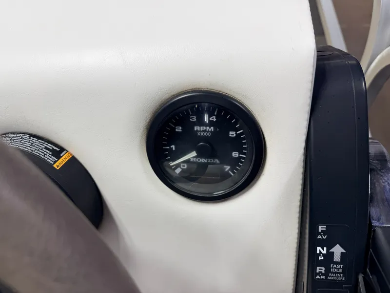 Slide: The Image of 2019 Forester Pontoon dashboard with Honda RPM gauge. - 16