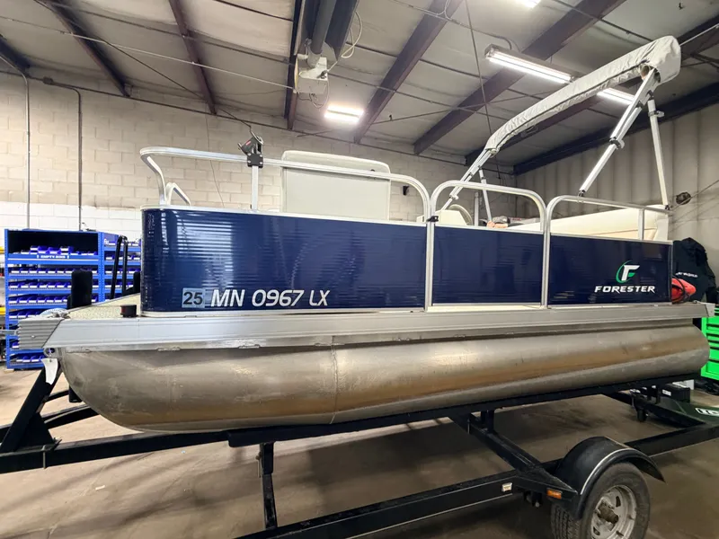 Slide: The Image of 2019 Forester 14' pontoon boat in warehouse, blue, for sale at $10,995. - 18