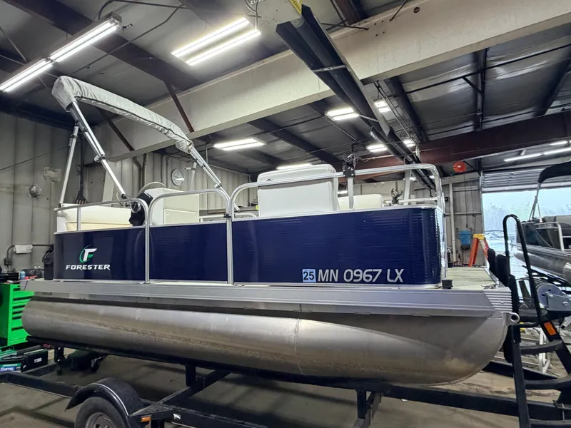 Slide: The Image of 2019 Forester 14' pontoon boat in warehouse, blue, for sale at $10,995. - 23
