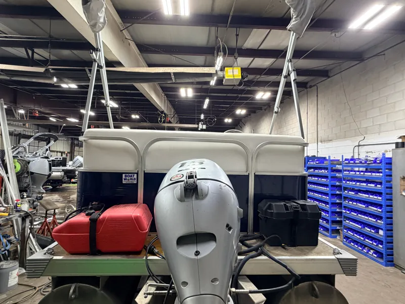 Slide: The Image of 2019 Forester 14' Fish n Fun Pontoon in storage area. - 28