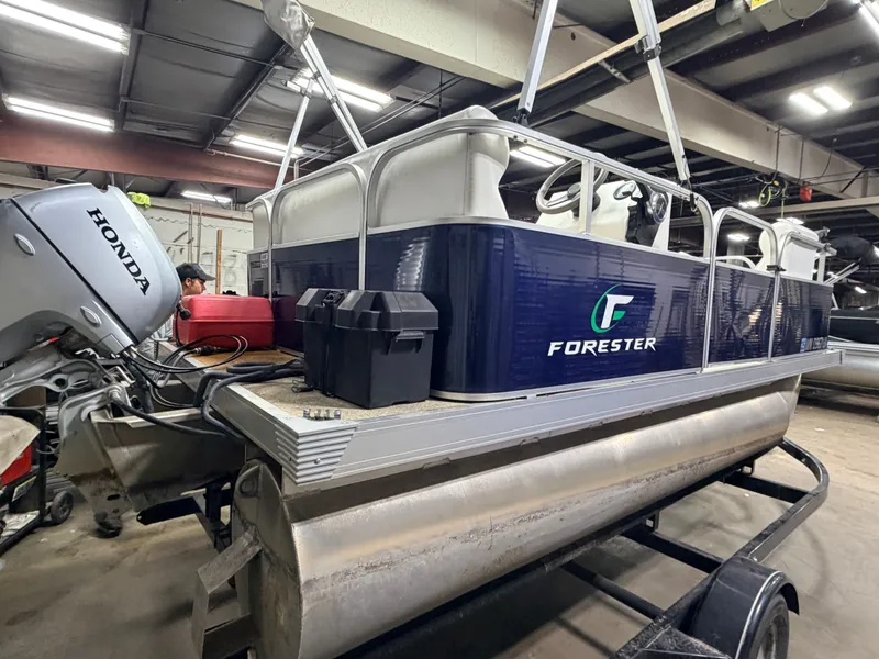 Slide: The Image of 2019 Forester 14' pontoon with Honda motor in warehouse. - 29