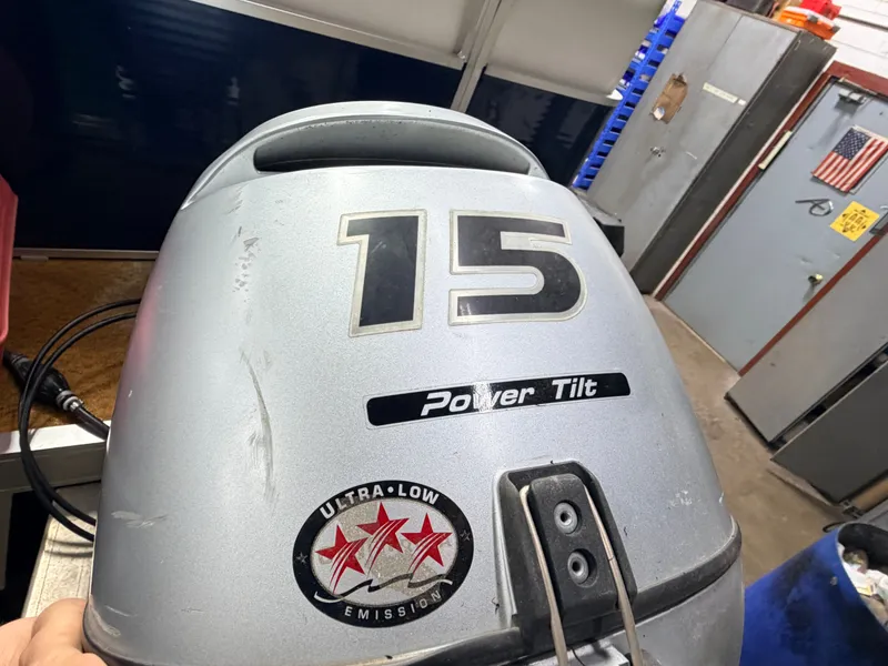 Slide: The Image of Outboard motor with 15 HP and Power Tilt, Ultra-Low Emission. - 31